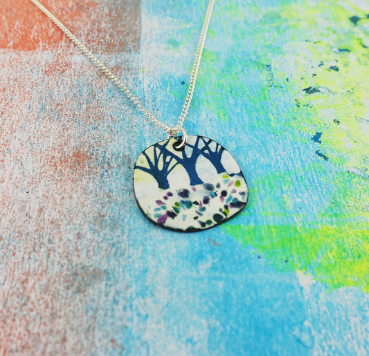 Unique artisan wearable art tree pendant close-up
Necklace with turquoise and white enamel