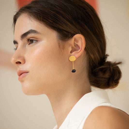 Golden Earrings and Black Miró Jewelry